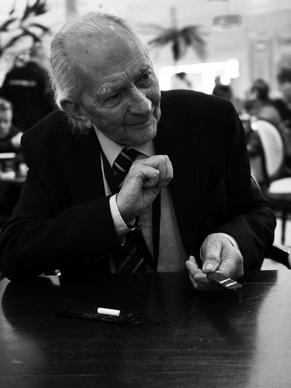 Pat Fallon performing close-up wedding magic at table level.
